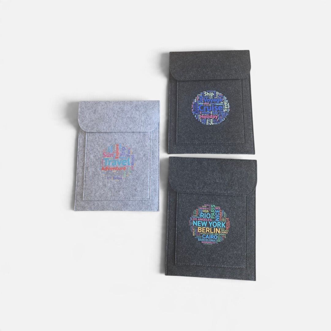 Well Travelled Wallets felt document holders in charcoal and light grey with travel-themed graphic prints