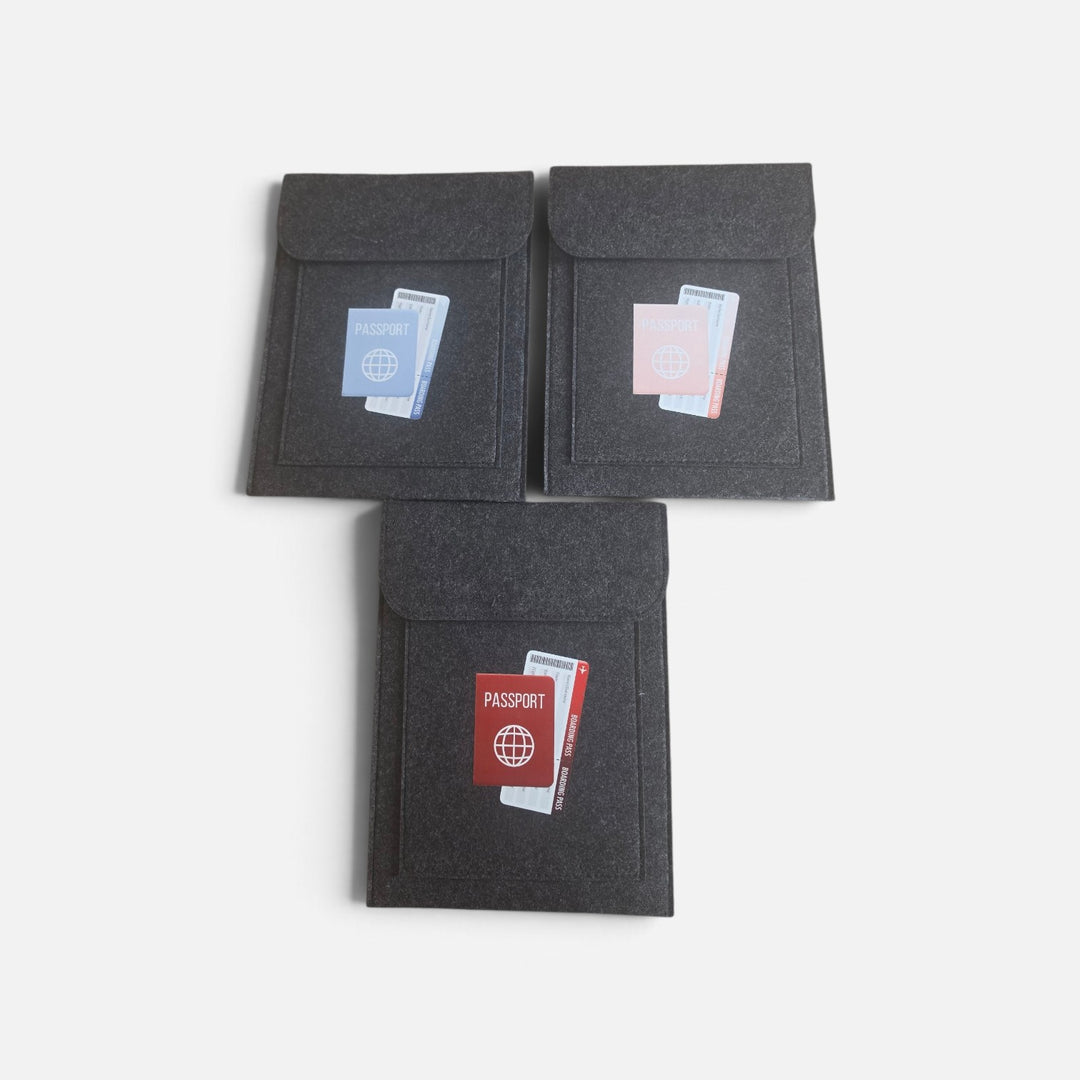 Well Travelled Wallets dark grey felt passport holders with colourful passport and boarding pass graphic icons